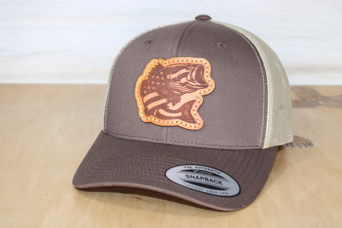 Brown and beige cap with leather fish emblem