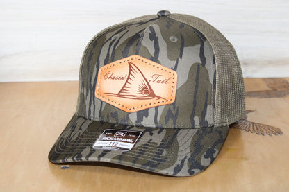 Camouflage-patterned cap with redfish leather patch