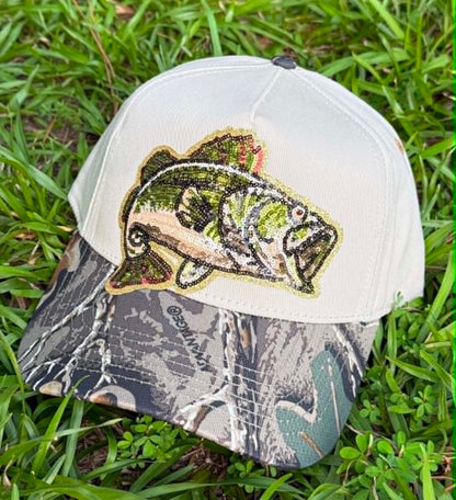 Cap with a fish design on a grass background