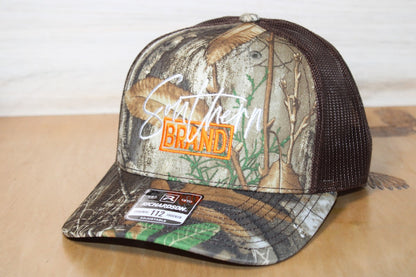 Camouflage trucker hat with 'Southland Brand' logo 