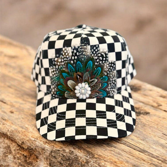 Black and white checkered cap with feather and flower design 