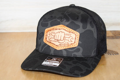 Black camouflage cap with leather patch