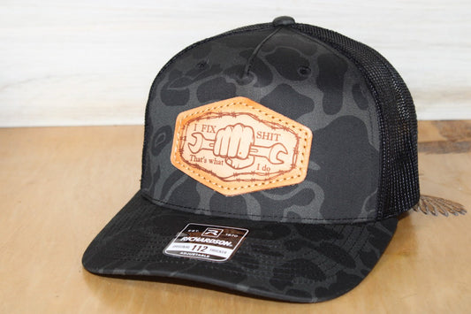 Black camouflage cap with leather patch