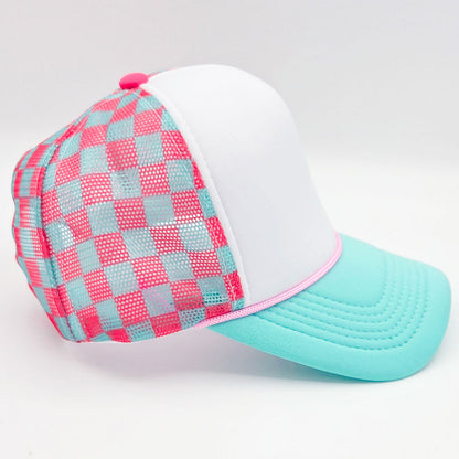 Checkered cap with pink and blue pattern on a white background