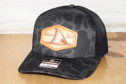 Camouflage-patterned cap with redfish leather patch