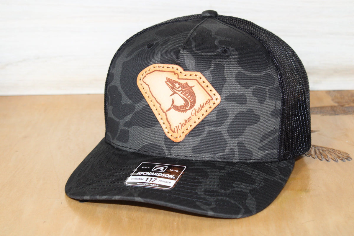 Black duck camouflage cap with a wahoo fish on a leather patch 