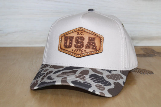 Bark Duck Camo Two-Tone Hat with camo bill and solid natural color back with USA leather patch 